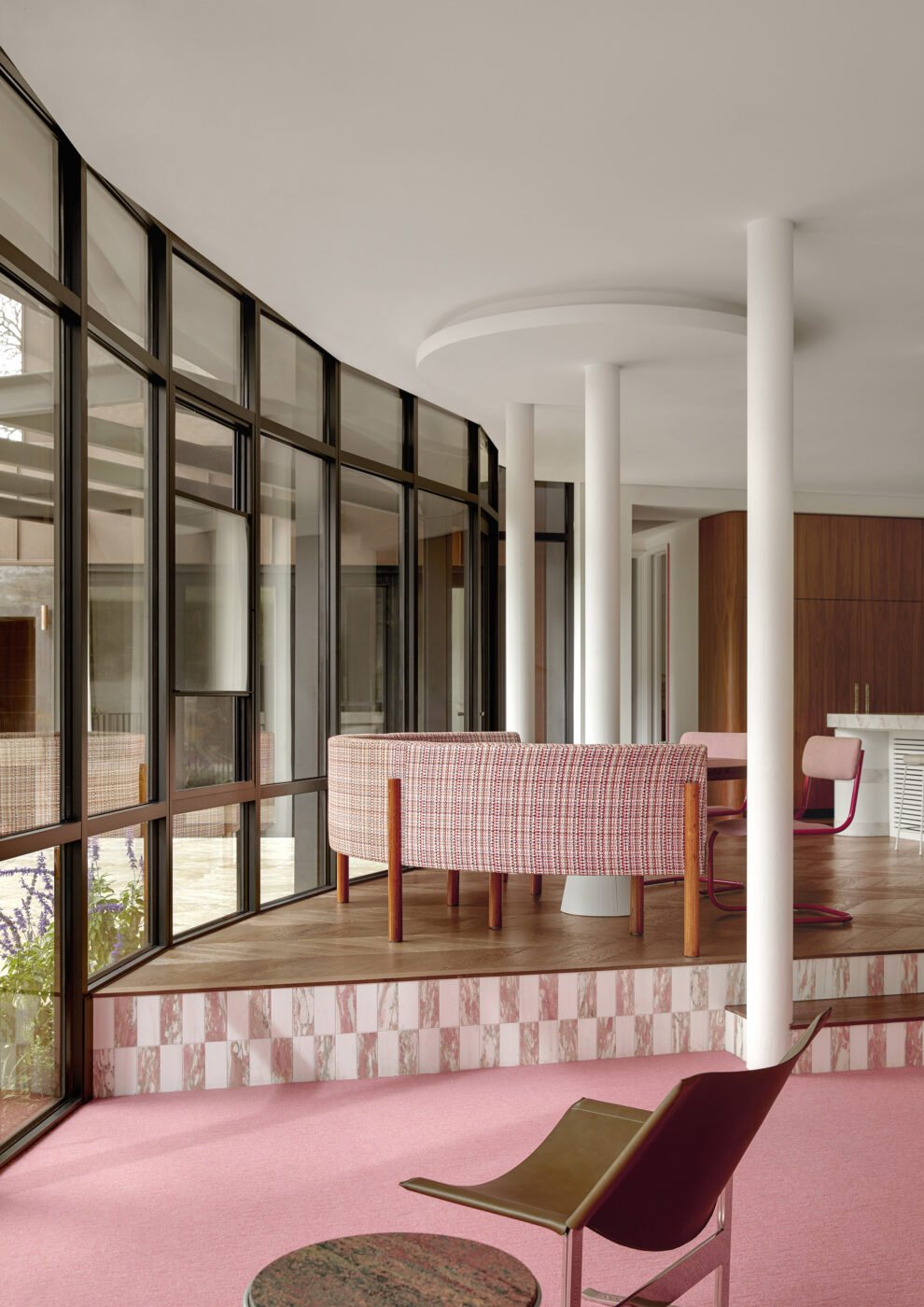 Secondary view of a custom-designed breakfast nook featuring a built-in upholstered banquette, round pedestal table and colourful furnishings, creating a relaxed and stylish space for everyday dining.